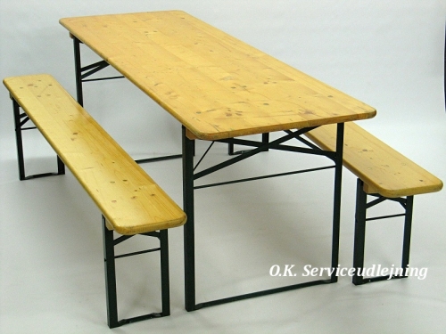 Eight shirts arranged on table in black, olive, grey, blue, white, red, mustard, and green.